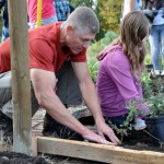Planting a garden bed at a space grant site