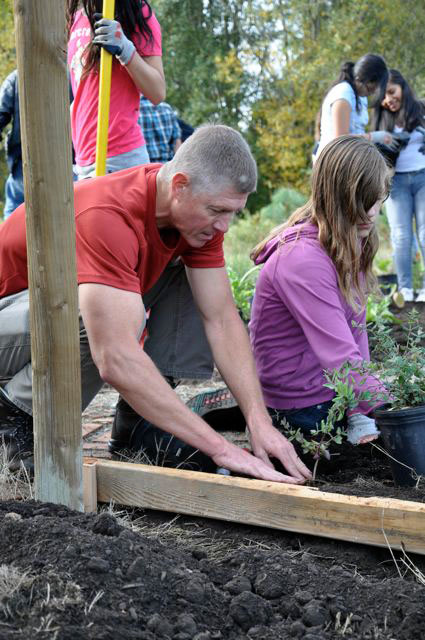 Planting a garden bed at a space grant site