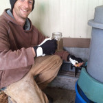 Pete holding compost tea from the brewer